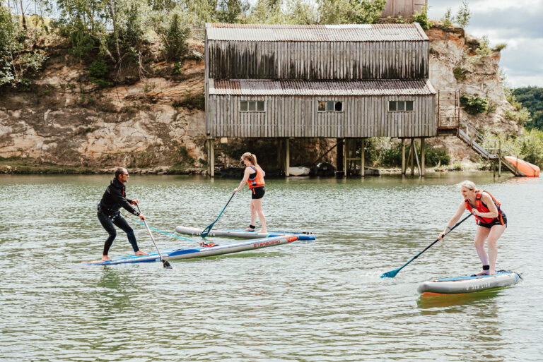 surrey hills adventure company stand up paddleboarding open water lake swimming